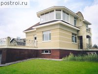 F-252-1P проект двухэтажного коттеджа из пеноблоков с цоколем и гаражом размером 11 на 10